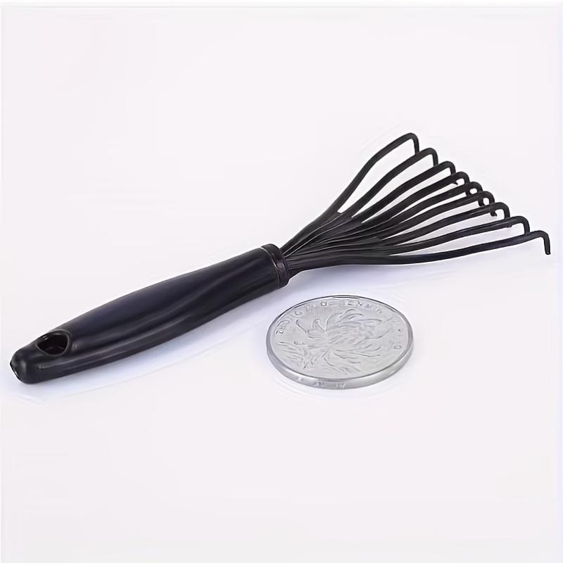 A Single Pack of Plastic Mini Comb Cleaner with Embedded Bristles a Hair Removal Tool for Home Use Featuring a Handle
