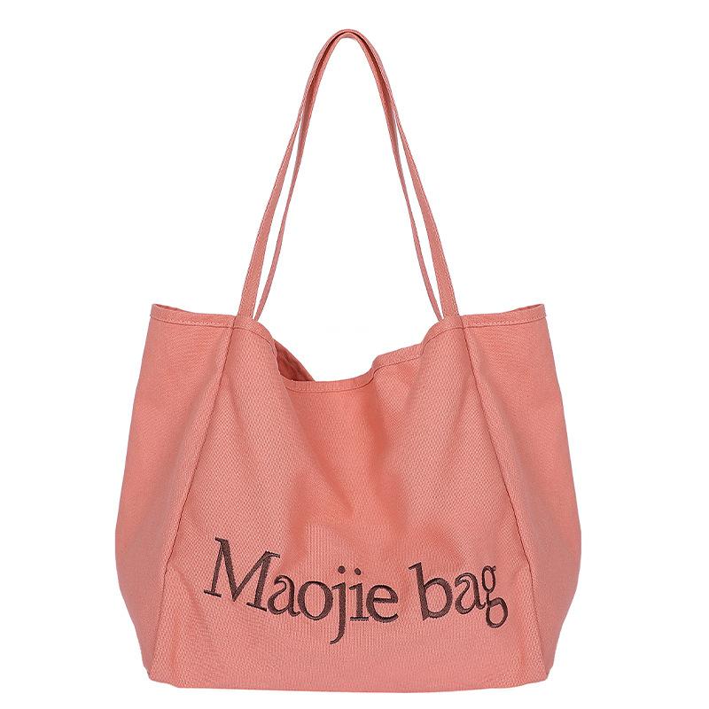 Large-capacity canvas bag, new niche versatile casual class commuting portable shoulder tote bag