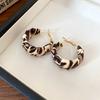 Silver needle leather leopard print wrapped round stud earrings Hong Kong-style millennial personalized earrings light luxury high-end earrings