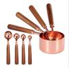 Gold-Plated Stainless Steel Measuring Cups & Spoons with Solid Wood Handles and Scale Markings for Baking.