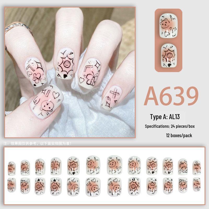 

Свіжі та милі короткі накладні нігті в стилі мультяшного граффіті