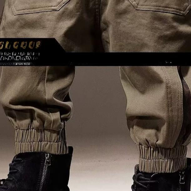 Męskie spodnie cargo z elastycznym pasem i wieloma wiązaniami, luźne, z wieloma kieszeniami i prostymi nogawkami, modne spodnie ogrodniczki