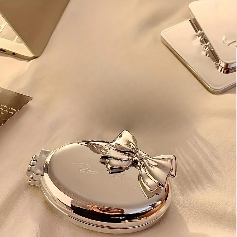 

Portable Mini Bow-Shaped Hair Comb - Nylon Bristles Folding Air Cushion for Normal Hair Travel-Friendly Styling Tool with Mirror серебряный