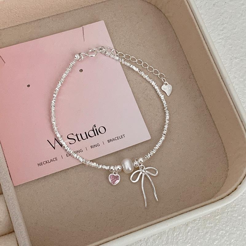 

Ожерелье из натурального жемчуга в форме розового сердца с серебряным ободком и бантом, розовые бриллианты, цепочка на ключицу