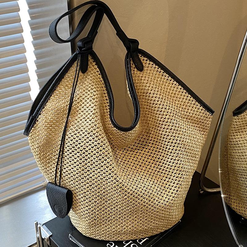 Summer new woven straw bag women's fashion niche shoulder bucket bag seaside beach bag
