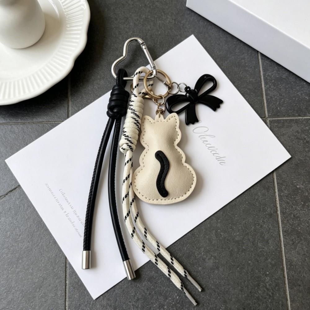 Joli chat en cuir avec corde tressée, Pendentif de sac avec breloque en acrylique, Accessoire esthétique pour breloque de sac pour femme beige