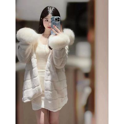 Manteau de fourrure femme à capuche col en fourrure fausse fourrure long manteau d'hiver femme style doux mondaine