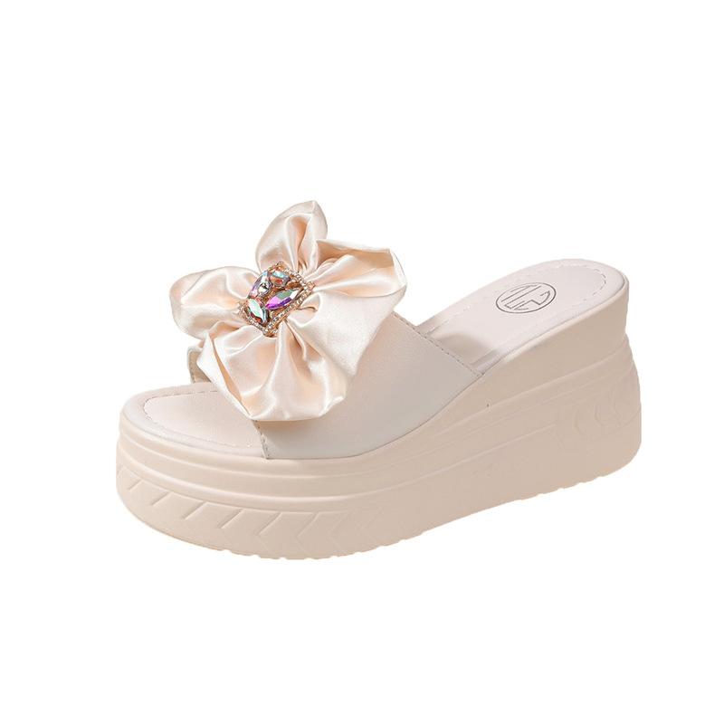 

Thick-bottomed cool slippers, female outer wear fairy style 2025 new summer fashion versatile wedge heel muffin slippers 39