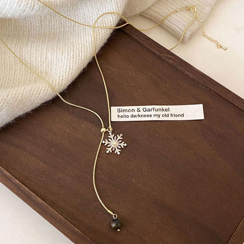 Zircon snowflake pendant can pull necklace women's autumn and winter sweater chain light luxury high-end temperament neck chain accessories