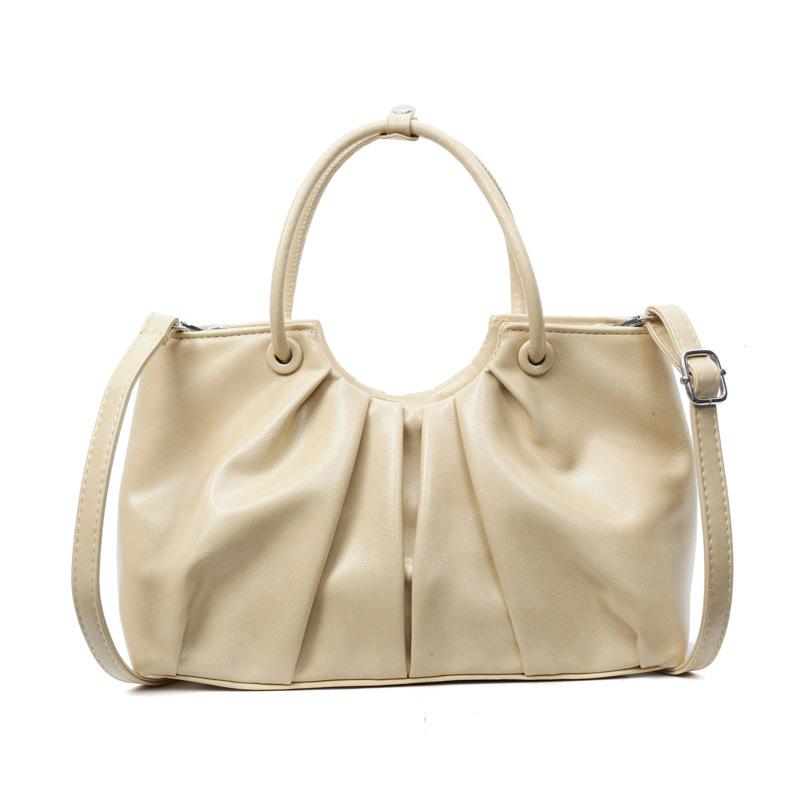 Korean version of foreign style niche design pleated handbag bag women's versatile foreign style advanced sense oil wax leather commuter messenger bag