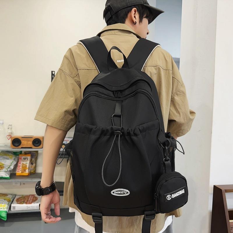 Casual backpack backpack new large-capacity Japanese and Korean boys college students solid color schoolbag