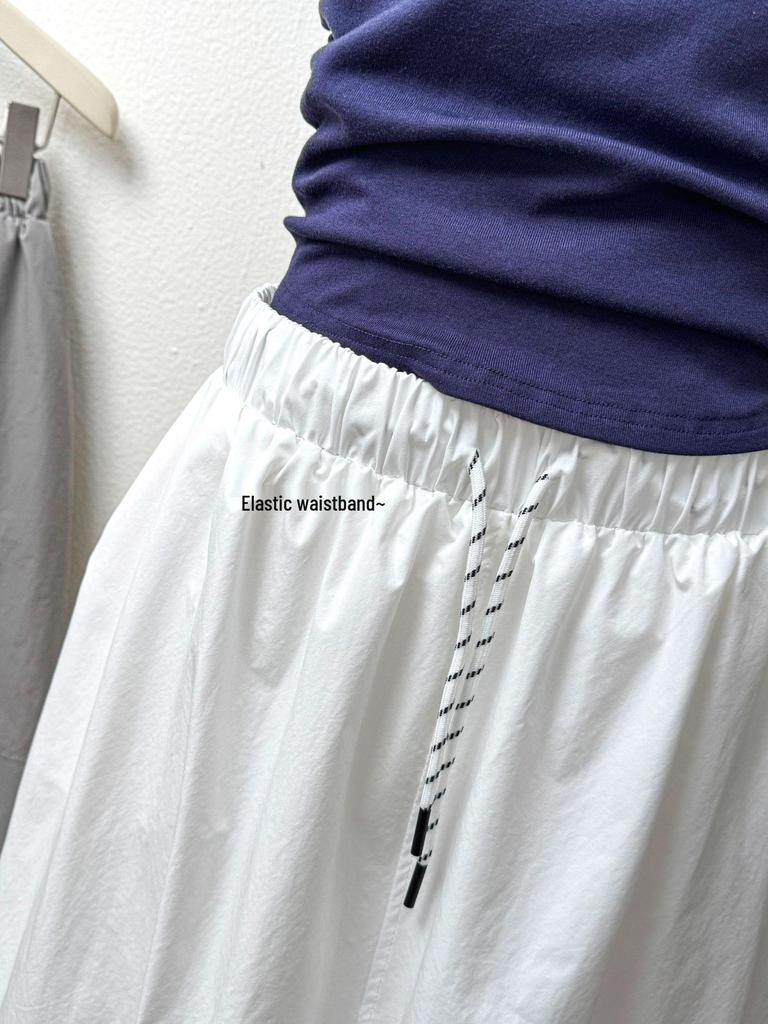 2026 Spring/Summer Retro Cocoon Mid-Length Elastic Waist Skirt - Stylish Solid Color Artistic Bud Design