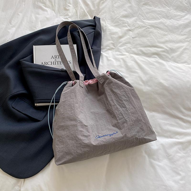 

Повседневная простая холщовая сумка женская 2025 весна и лето большая вместимость корейская версия сумка-тоут модный тренд сумка через плечо женская серый