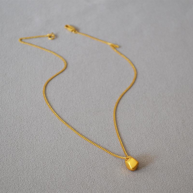 Gold-Plated Brass Pendant Necklace with Irregular Faceted Design - Retro, Versatile, and Stylish.