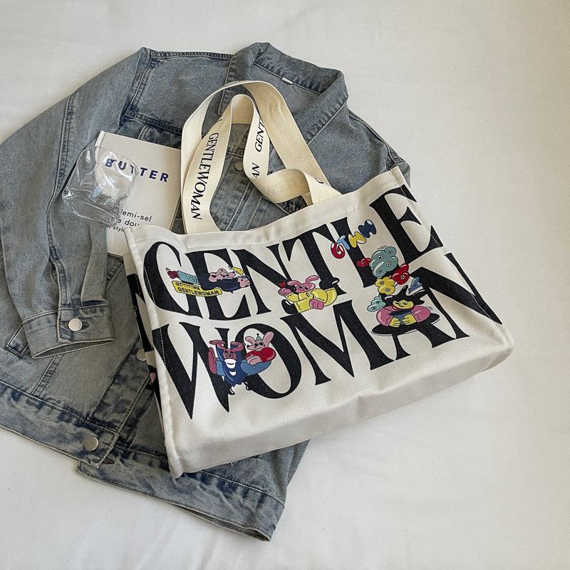 Canvas bag women's large capacity 2025 new bag portable commuter bag casual fashion fresh bag single shoulder mommy bag