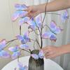 An artificial butterfly branch used for weddings, family offices, parties, decorating vases, and floral arrangements