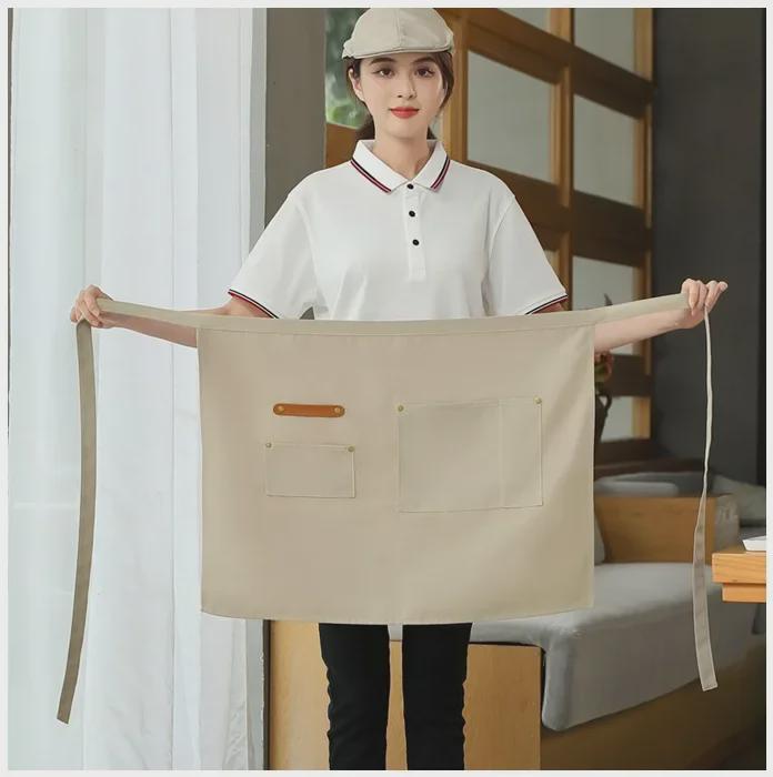 Unisex vanntett kjøkkenforkle i kanvas med halvlangt design og logo i midjen