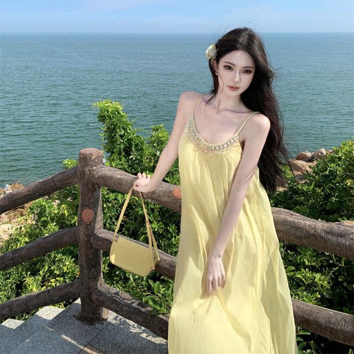 

Sanya seaside travel and vacation super fairy suspender dress summer new loose and thin eye stunning beach dress XL
