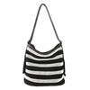 Striped woven bag women's 2025 new seaside super fire hollow tote bag large capacity fashion commuter messenger bag
