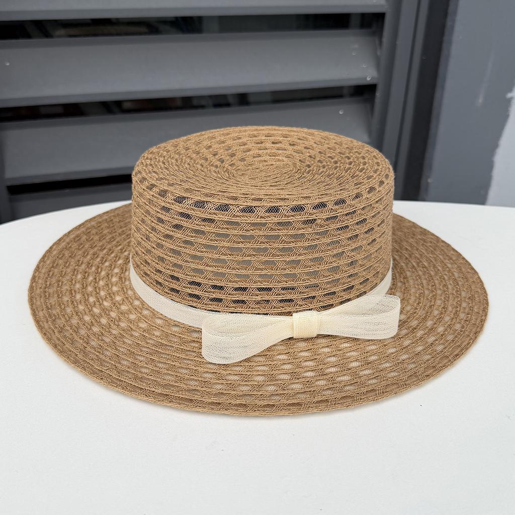Spring and summer new hollow seaside photo hat women's beach vacation sunshade straw hat big edge flat top sunscreen top hat