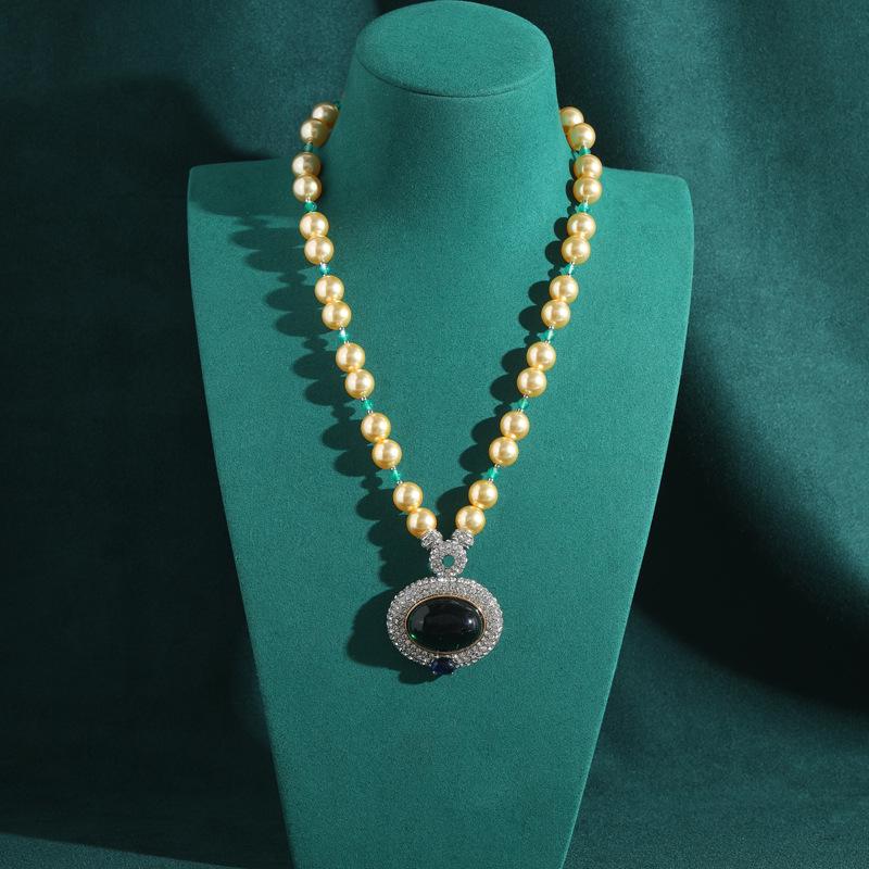 Yong Nuo Aged Gold Pearl Necklace with Black Gems and Diamond Border Pendant