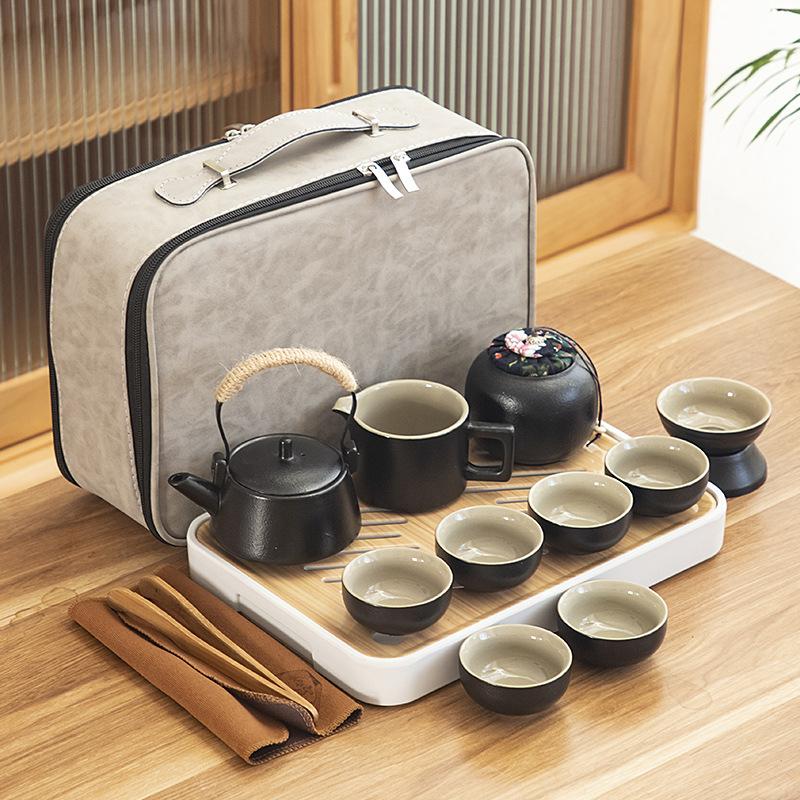 Black pottery travel kung fu tea set portable business gift set creative ceramic cooling pot set