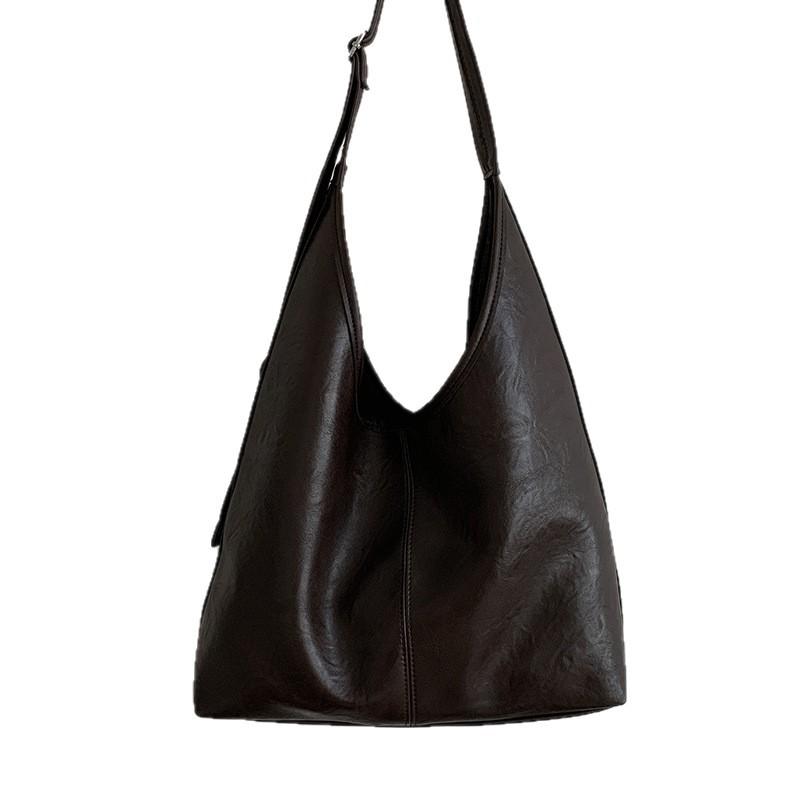 Retro high-end bucket bag women's 2025 new fashionable solid color simple shoulder armpit bag versatile commuter bag