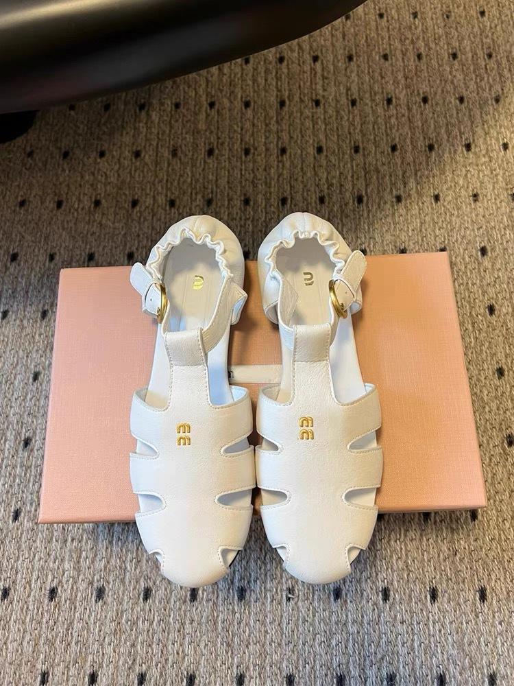 Baotou Roman sandals women's high new retro hollow versatile leather flat-bottomed casual pig cage shoes