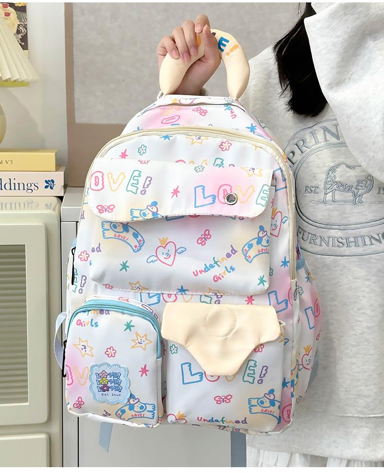 

School BagsNew campus style graffiti travel backpack, light and large capacity, cute travel and leisure backpack for junior high school students Small білий