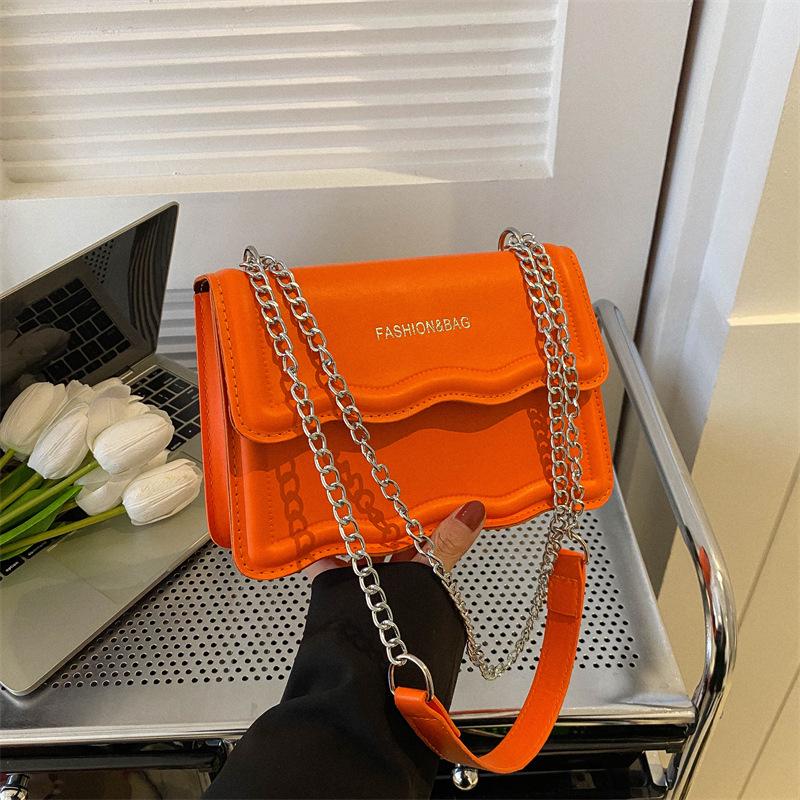 Korean Style Small Square Women's Crossbody Bag - 2025 Solid Color, Wave Pattern, Chain Shoulder, Simple Fashion.