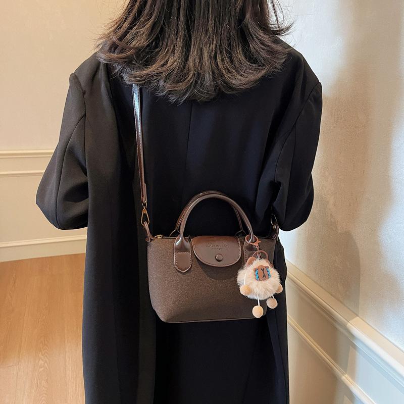 

Французская мода женские сумки 2025 новые трендовые женские сумки высокого класса универсальные сумки-мессенджеры модные женские сумки сумки-пельмени 23*8*14