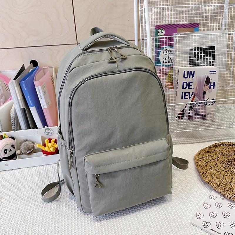 

Модний рюкзак Нова нейлонова надлегка сумка для відпочинку Велика місткість дорожня сумка Шкільний рюкзак для учнів середньої та старшої школи single package сірий колір