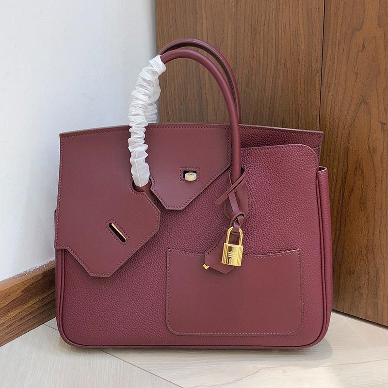 

Высококачественная сумка из коровьей кожи высшего слоя платиновой отделки с лоскутным контрастом цветов из кожи неправильной формы, женская сумка, сумка-тоут, карманная сумка большой вместимости 30x12x25cm вино красного