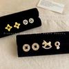 Chic Zirconia Coin Stud Earrings: Hollow-Out Design, Lightweight, Luxurious Feel, High-End Fashion.