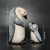 A Set of Two Resin Statues Featuring a Mother And Penguin Showcasing a Creative Family Theme These Can Serve As Decorative Pieces for Home