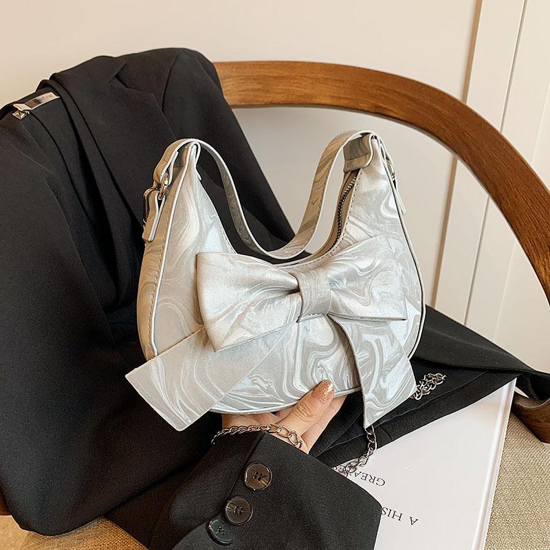 

Niche design underarm bag women s 2024 new fashion trendy casual bow shoulder bag crossbody crescent bag срібний