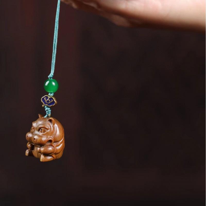 Twelve Zodiac Animal Charms Green Sandalwood Set: Rat, Ox, Tiger, Rabbit, Dragon, Snake, Horse, Sheep, Monkey, Rooster, Dog, Pig.