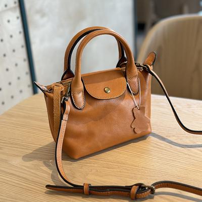Lente en Zomer Plantaardig Gelooid Koeienhuid Dames Handtas, Schoudertas, Leren Casual Knoedeltas, Mini Crossbody Tas