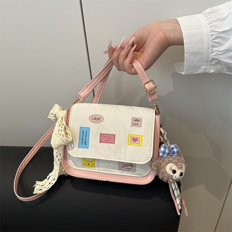 Versatile and foreign style spring new simple small square bag women's fashion high sense temperament light luxury design messenger bag