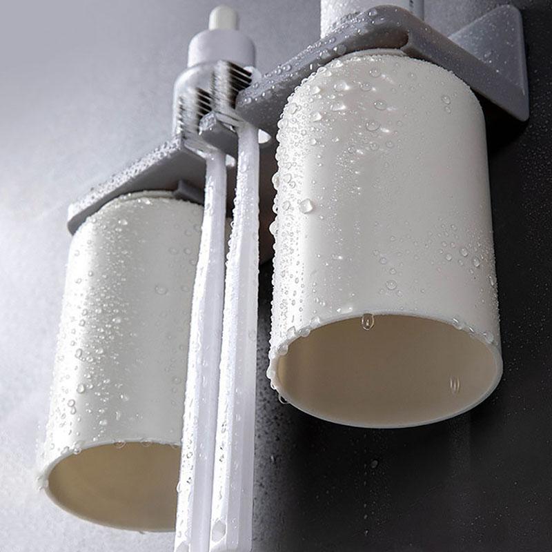 Badezimmerzubehör Wandmontierter Zahnbürstenhalter Doppelbecher Upside Down Toilettenzahnpasta-Aufbewahrungsregal Haushaltswaren