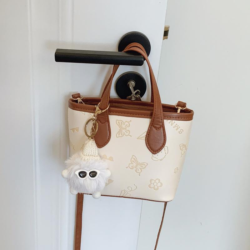 

This year, the popular contrasting color small bag women s 2025 new versatile messenger bag super fire embossed portable bucket bag wholesale Without pendant