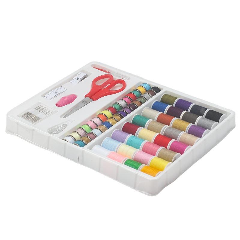 DIY Sewing Kit: Needles, Thread, Bobbins, Scissors, and Accessories for Mending and Home Sewing Machine Use.
