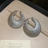 European and American geometric round hollow woven earrings, fashionable and elegant earrings, niche design earrings for women
