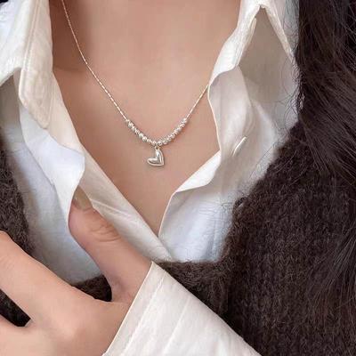 Heart-Shaped Beaded Necklace: Light Luxury Clavicle Chain for Women, Cool and Simple Style, Perfect Sweater Accessory.