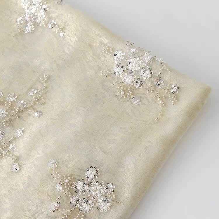 

The new golden lace-bottom organza-bottom double-layer sequin embroidered fabric can be used for wedding dresses and formal gown 1.5M&1M золотистый