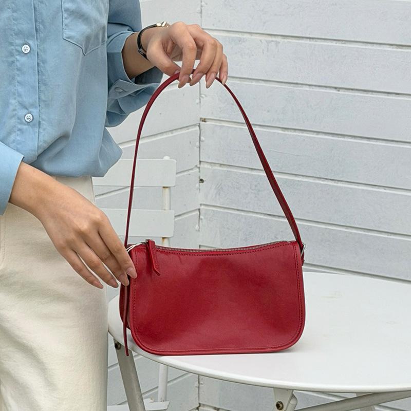 

Retro leather underarm bag 2 new casual niche baguette bag versatile minimalist style first layer cowhide messenger bag Length 24cm thickness 10cm height 13cm червоний