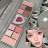 Heartbeat Twelve-Color Heart-Shaped Eyeshadow Palette: Pearlescent, Fine Glitter, Matte, Blush, Highlighter for Enhanced Complexion.