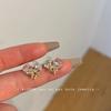 Bow winding love pink zircon light luxury high-end stud earrings small exquisite ear clips women's earless earrings