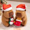 1Pc 20/25CM Kawaii Christmas Capybara Plush Toys Cartoon Capibara Dolls Wears Xmas Hat Holding Gingerbread Man Nice Christmas Gift
