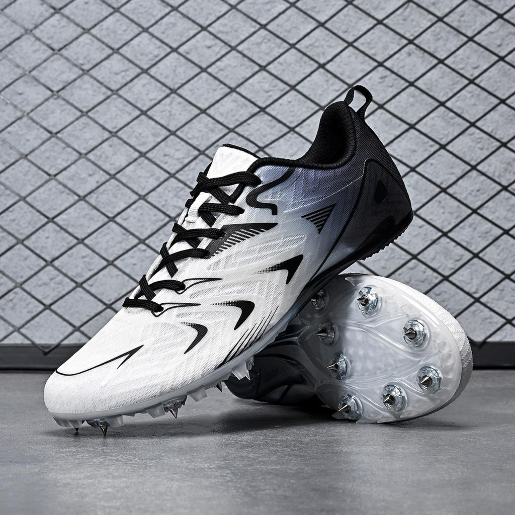 Herren Damen Laufschuhe mit Spikes Professionelle Laufschuhe Sprintschuhe Weiches Feld Rutschfest Athletische Nägel Rennen Rennsport Weitsprung Leichtgewicht